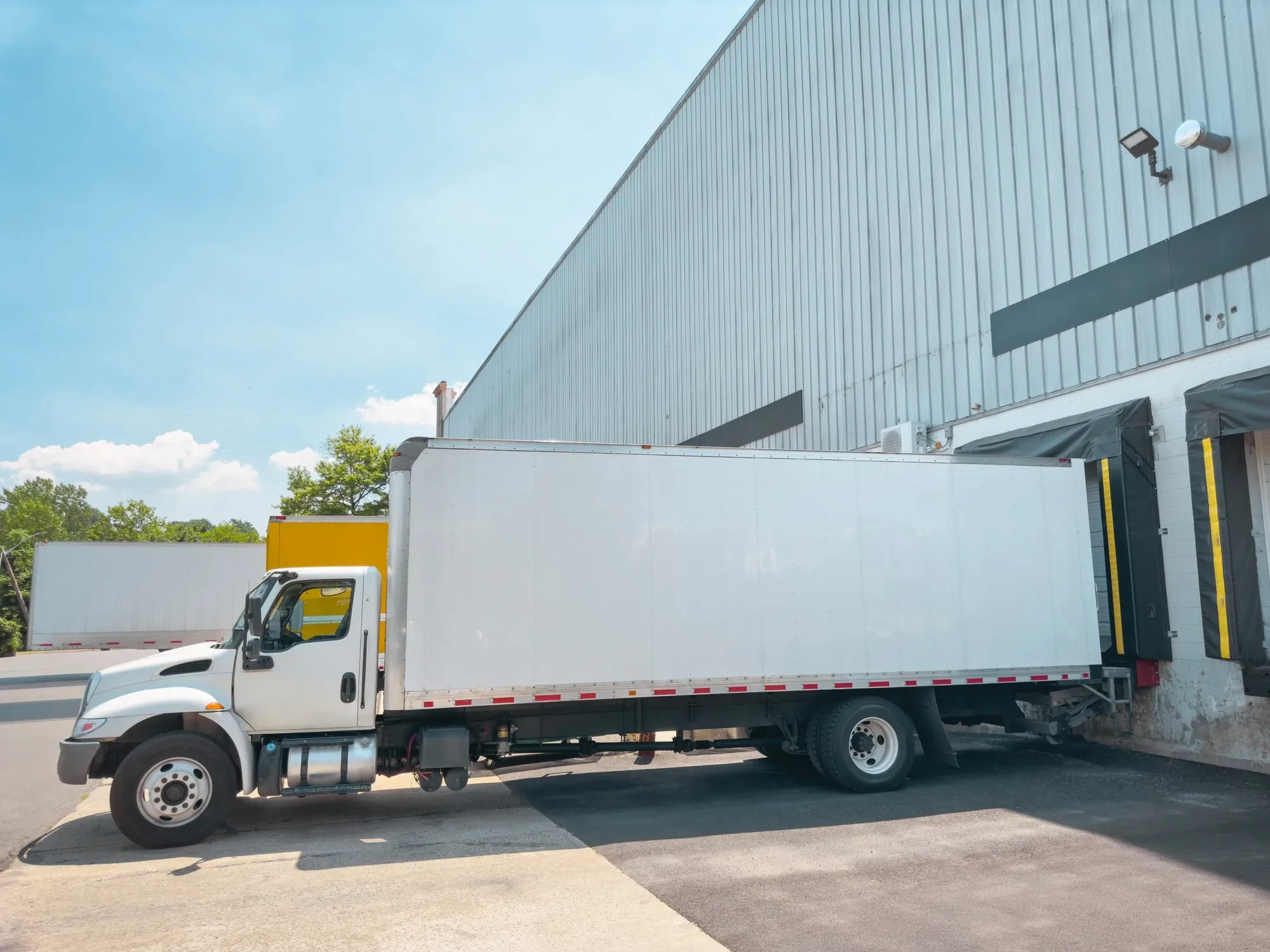 Ascora Logistics box truck at warehouse loading dock